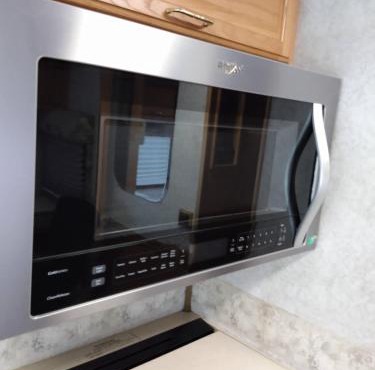 32 foot camper in country setting