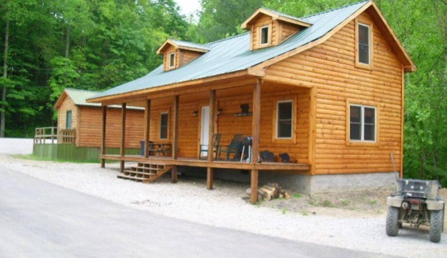 3BR, 1 Bath Cabin with hot tub, full kitchen, and living room.