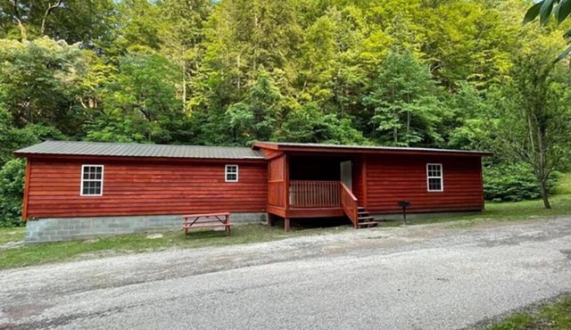 3BR, 2 Bath Cabin with full kitchen, living room, and hot tub.