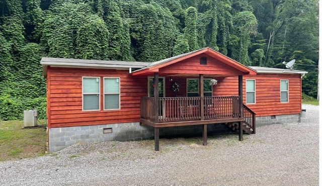 3BR, 2 Bath house with full kitchen, living room, and hot tub.