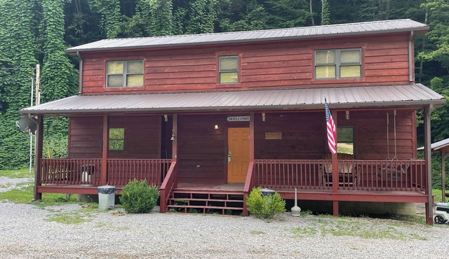 3BR 2 Bath house with full kitchen, living room, and hot tub.