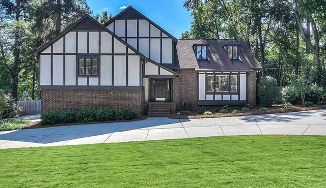 4,000 sf home offers 6 bedrooms, 3 full baths, and 3 separate living rooms,