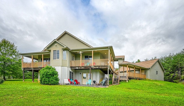 +4 acre lakefront retreat with private boat slip, wraparound porch, grill, & W/D