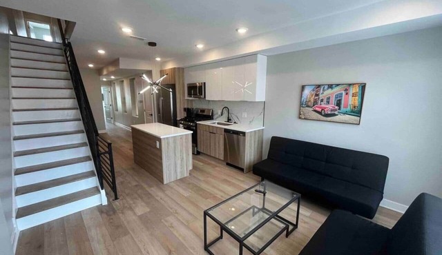 4 bed bi-level with roof deck. In the city.