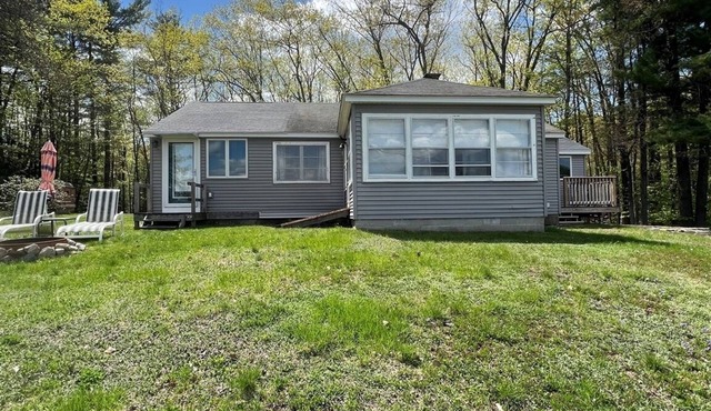 4 bedroom 1 bath. Large Yard, Short walk to public beach.