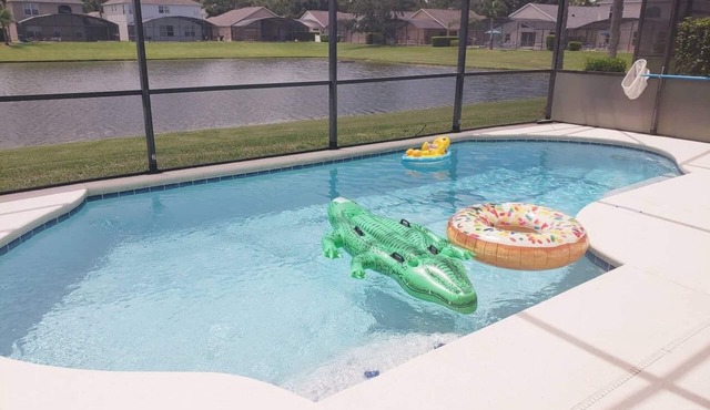4 bedroom, 3 bath private pool home with a lake view , fully equipped and clean