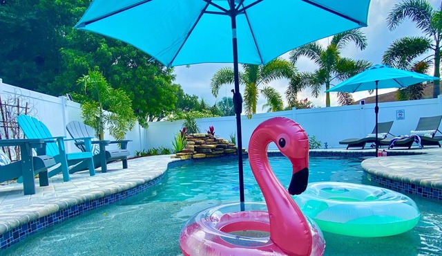 4 bedroom home with heated saltwater pool and hot tub. Close to the beach!