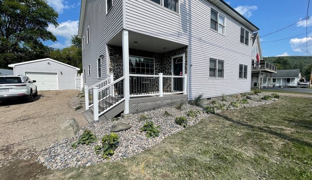 4-bedroom house on DeRuyter Lake with WiFi, Fitness room, AC and Hot Tub!