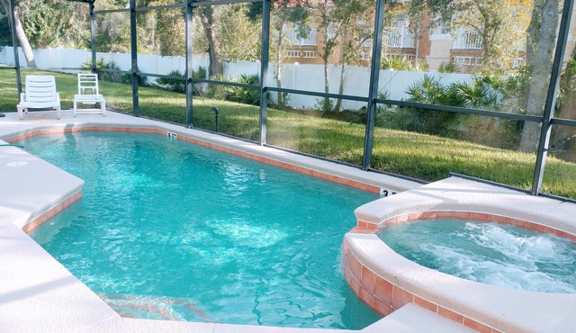 4 bedroom single story house with south facing pool and spa close to Disney