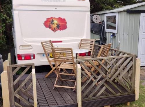 4 berth caravan in a garden, nestled in the trees