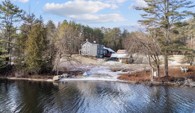4 BR modern farmhouse with 173 ft of private lakefront on tranquil Loon Lake.