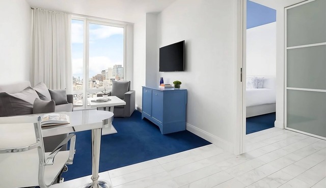 4 Elegant Deluxe Suites with Living Room! Offering sweeping views of NYC!