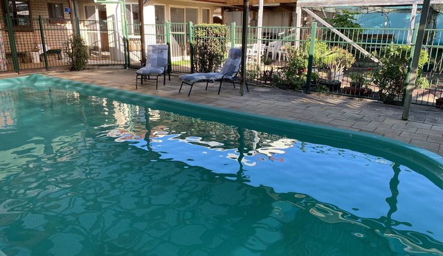 4 or 5 bedroom home with solar heated, undercover outdoor pool. Pet friendly.