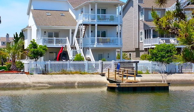 4bd Canal Front home with an Elevator, dock, fenced back yard, 2 master suites