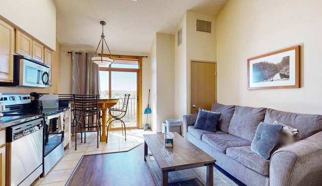 4th-floor coursefront condo with balcony & washer/dryer