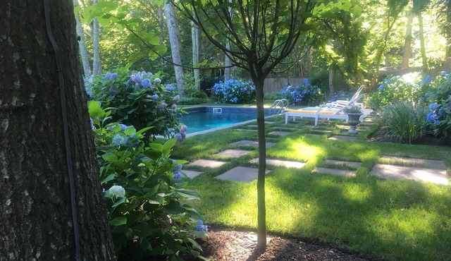 5.5 miles to U.S. Open! Swim in a sea of hydrangeas on this bucolic property.