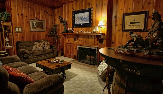 5 Bedrooms, 5.5 Baths, covered porches, hot tub, game room, walk to the square.