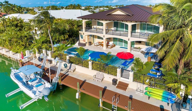 5 bedrooms, pool/spa heated, bikes, kayaks, game room, elevator, deep 75' dock.