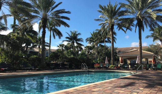 5 min to beach, ground level w garage, heated pool, resort style, very nice