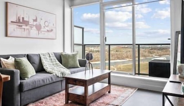 5 min Walk to Stampede | King Bed | Sofa Bed | AC