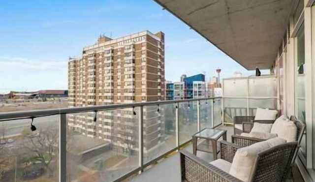 5 min walk to Stampede | 2BR | AC | UG Parking