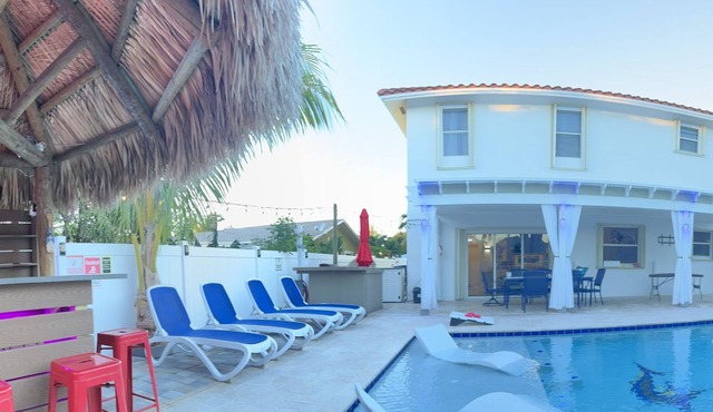 5 Mins to beach; 5BD, 4.5BA, Heated pool, Jacuzzi, Mini Golf, Tiki Huts.