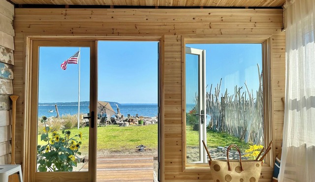 5-star modern beach cabin steps from the Useless Bay.