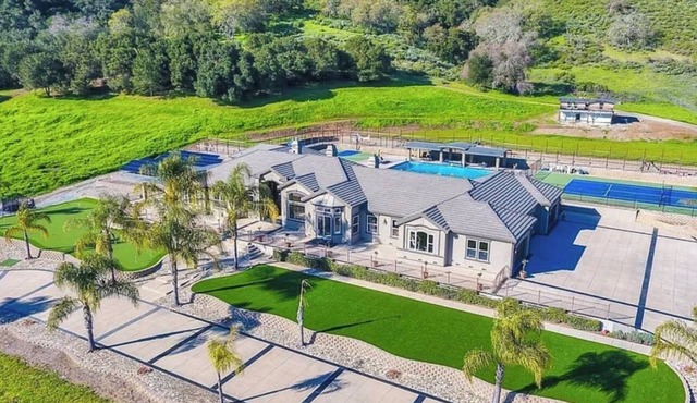 5600 sqft on 40 acres, 5 beds, 4 baths, swimming pool, Tennis Basketball courts.