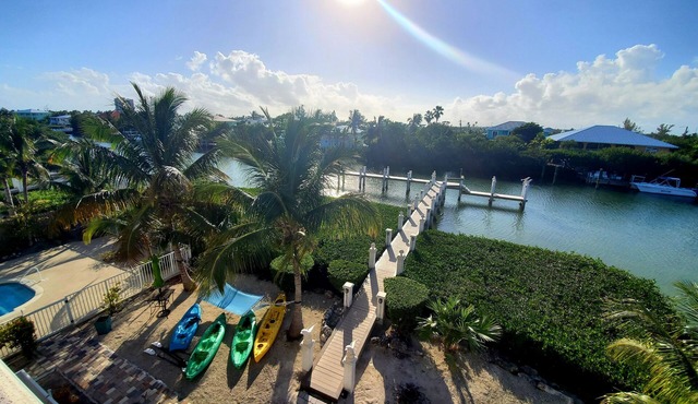 5BR luxury home w/pool, theater, rooftop deck & 100-ft dock near beach!