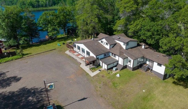 6 BED/4 BATH, RESORT/LODGE ON LAKE IN SPOONER! ENJOY LAKE LIFE, FISHING & TRAILS