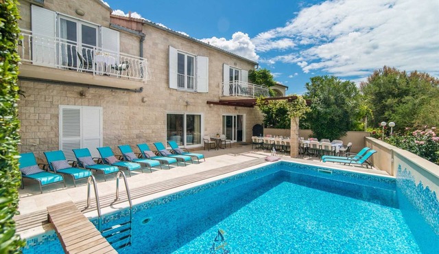 7-BR Beachfront Villa with Seaside Terrace and Heated Swimming Pool