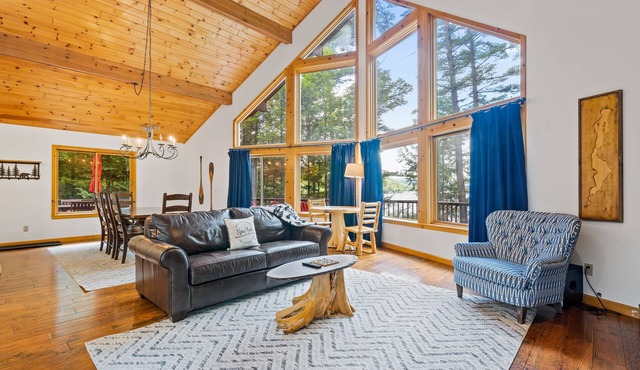 8.5-acre lakefront retreat with private beach, deck, grill, firepit, & game room