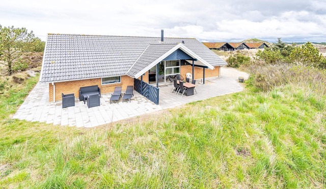 8 person holiday home on a holiday park in Henne