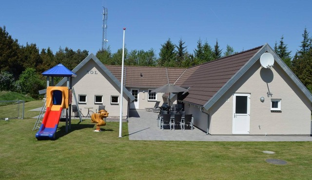 9 person holiday home on a holiday park in Blåvand