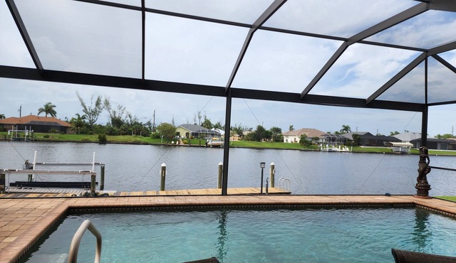 A 100+ reviews Family friendly home on canal with gulf access and heated pool!