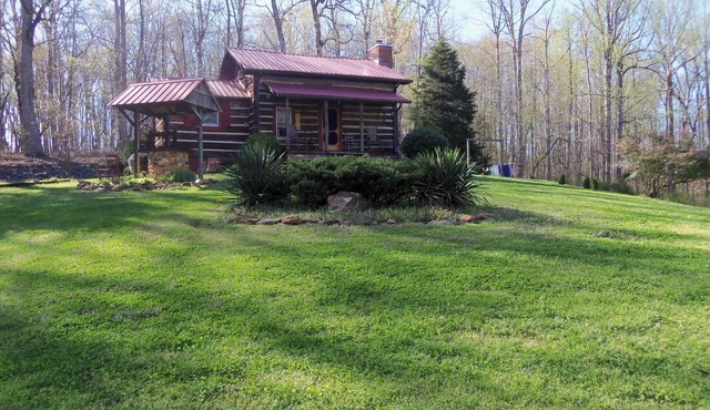 A authenic early American cabin located on a 85 acre farm in NC Foothills.
