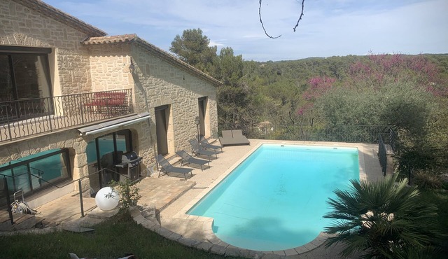 A balcony overlooking the pine forest