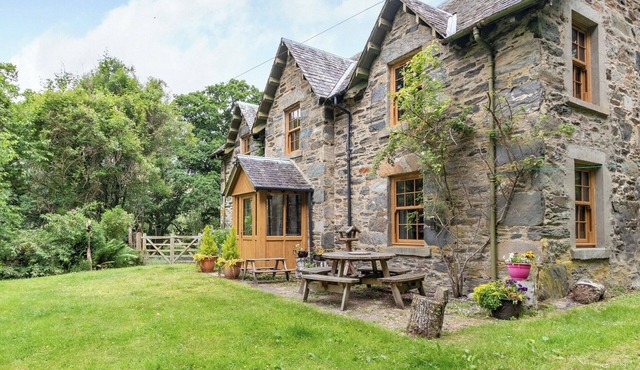 A beautiful former estate cottage, awash with character, nestling within its own ancient woodland.
