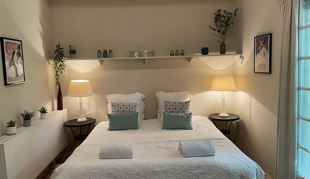 A beautiful romantic bedroom with a mezzanine area, bathroom and private garden