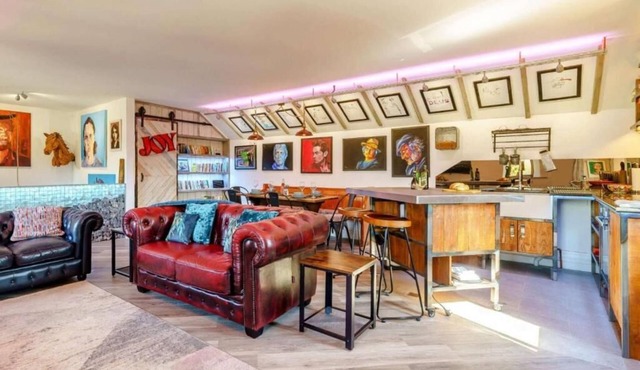 A beautifully appointed apartment featuring lots of original artwork.