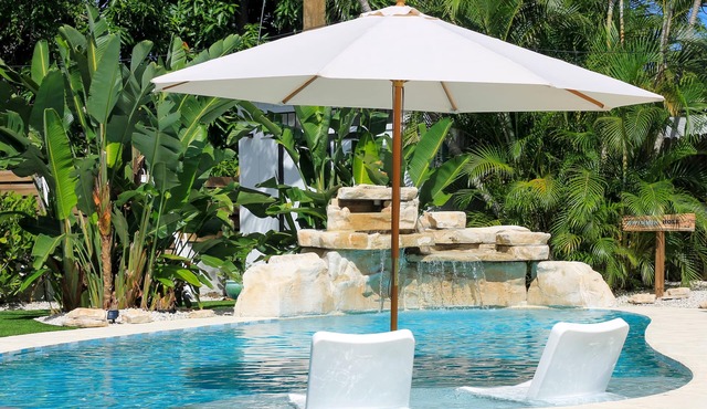 A beautifully renovated private home with a large backyard, Pool, and Hot Tub