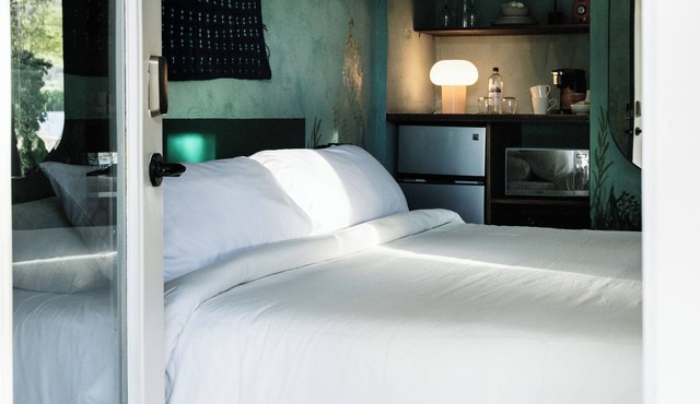 A boutique-hotel-style suite with a private entrance, tucked into our wild garden landscape.