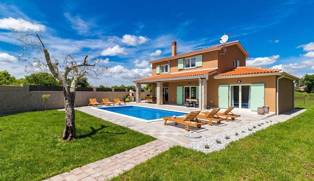 A bright and serene holiday home with private pool and children's playground
