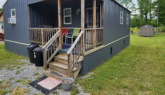 A cabin for the whole family, complete with washer & dryer and a swing set