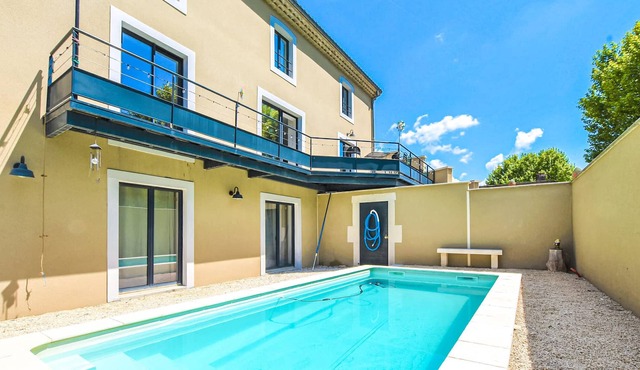 A charming domicile with outdoor pool and spacious living area.
