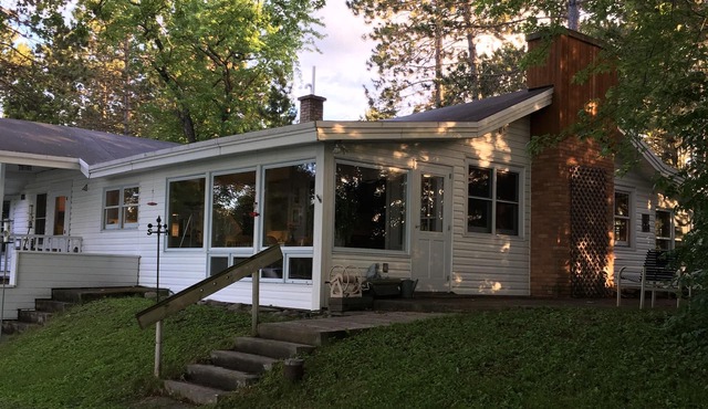 A charming home on a beautiful peninsula on a crystal clear lake.