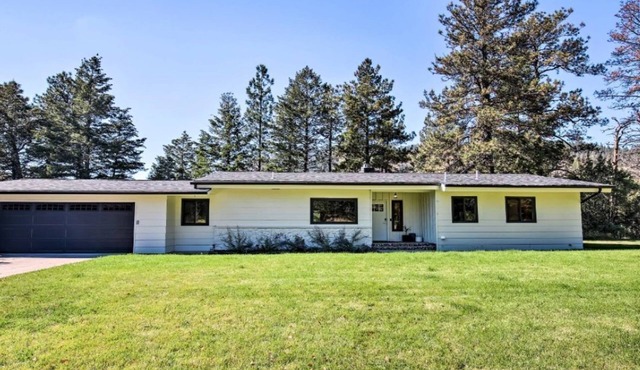 A charming riverfront 3-bedroom house bordering the Clark Fork River.