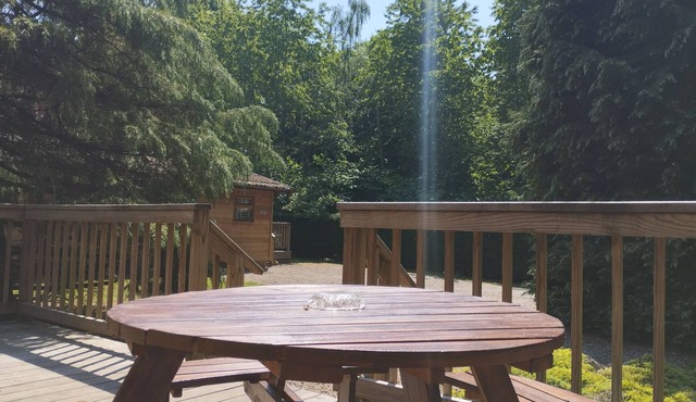 A charming & traditional Scandinavian log cabin within a tranquil setting.