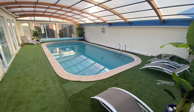 A cinema experience and a large private swimming pool in a peaceful setting