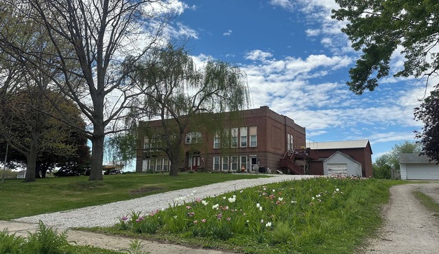 A Class-y & spacious 1500 square foot retreat in a century old brick schoolhouse